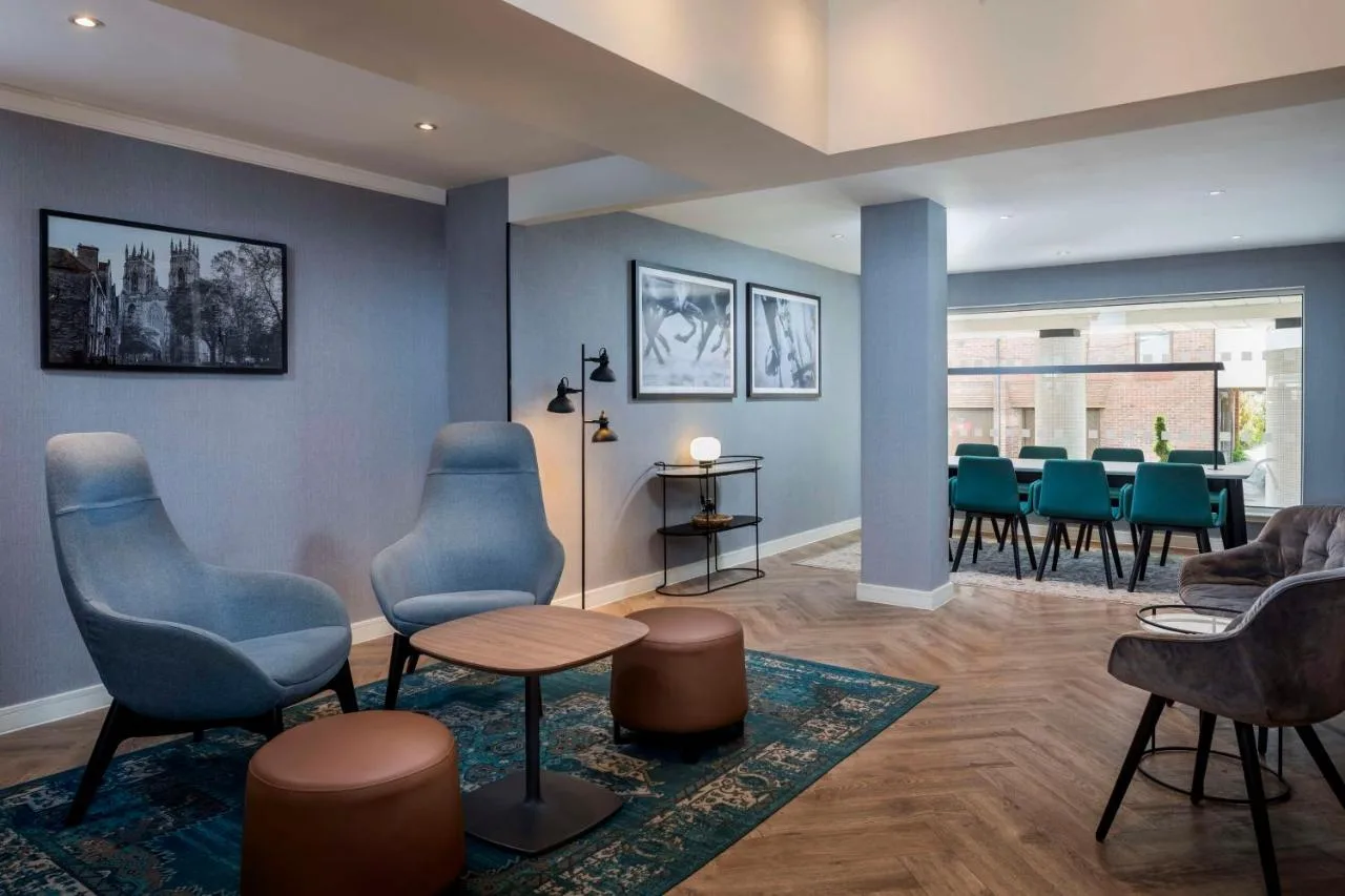 Blue chairs in a waiting area at Radisson Hotel York, York